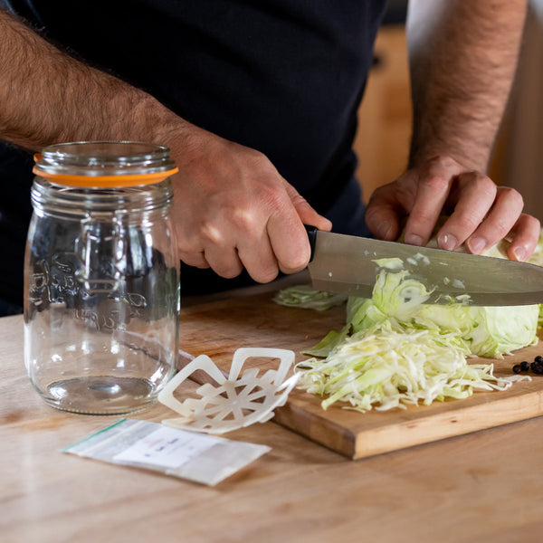 Cutting the cabbage for making sauerkraut using kit